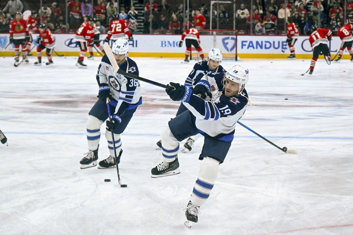 Jan 19, 2026; Chicago, Illinois, USA;  Winnipeg Jets center Jonathan Toews (19) warms up with teammates before the game against the Chicago Blackhawks at United Center. Mandatory Credit: Matt Marton-Imagn Images