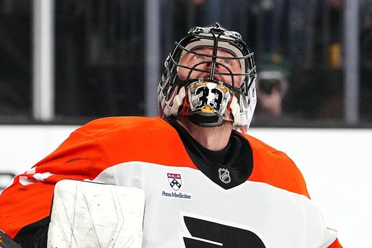 Jan 19, 2026; Las Vegas, Nevada, USA; Philadelphia Flyers goaltender Samuel Ersson (33) watches the puck after deflecting a Vegas Golden Knights shot during the first period at T-Mobile Arena. Mandatory Credit: Stephen R. Sylvanie-Imagn Images