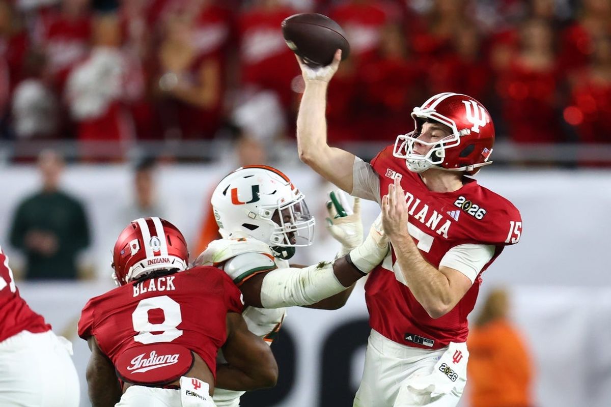 Jan 19, 2026; Miami Gardens, FL, USA; Indiana Hoosiers quarterback Fernando Mendoza (15) drops back to pass against the Miami Hurricanes in the first half during the College Football Playoff National Championship game at Hard Rock Stadium. Mandatory Credit: Mark J. Rebilas-Imagn Images