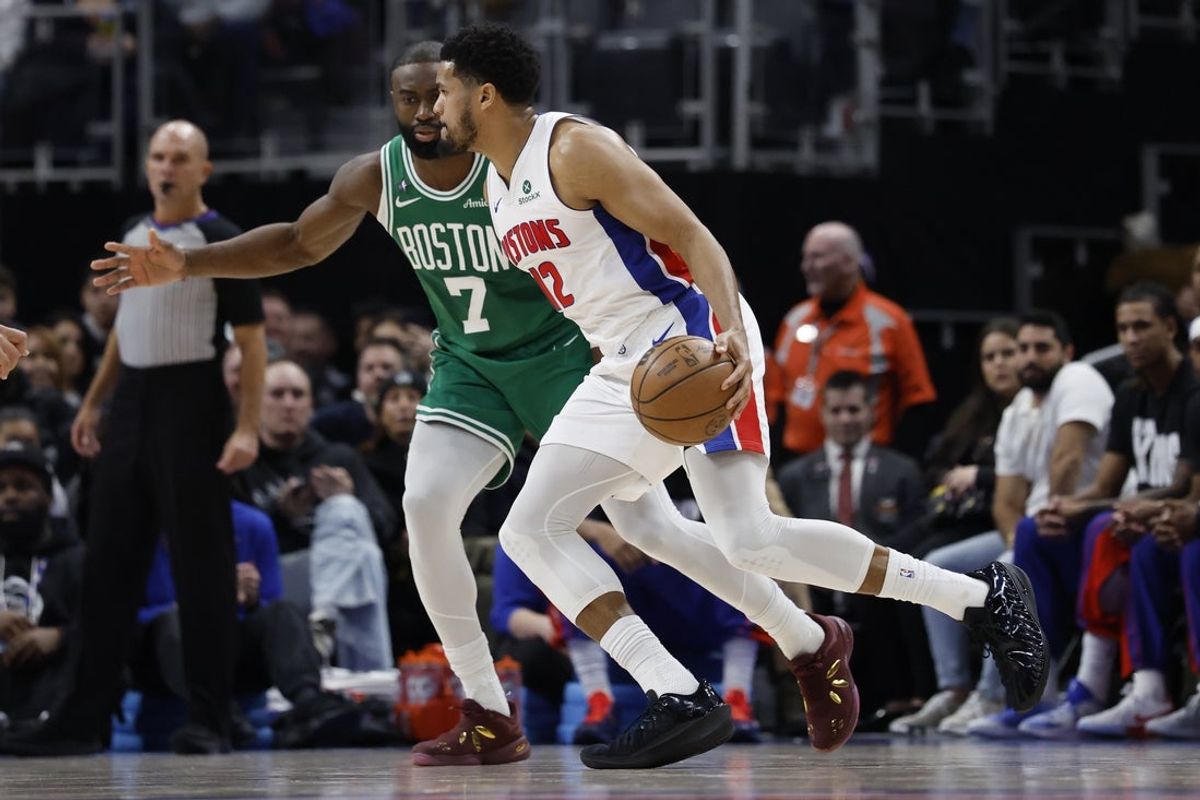 Jan 19, 2026; Detroit, Michigan, USA;  Detroit Pistons forward Tobias Harris (12) dribbles the ball against Boston Celtics guard Jaylen Brown (7) in the first half at Little Caesars Arena. Mandatory Credit: Rick Osentoski-Imagn Images