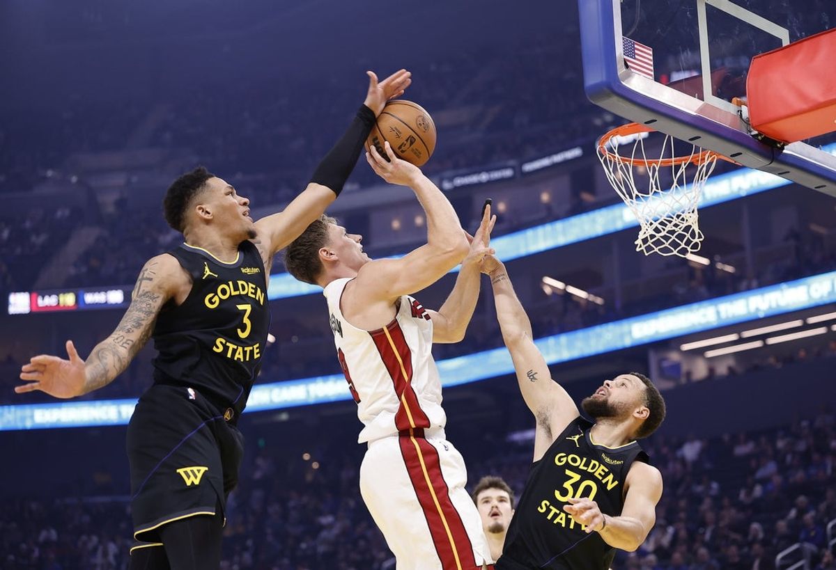 Jan 19, 2026; San Francisco, California, USA; Golden State Warriors guard Will Richard (3) swats away the ball on a shot by Miami Heat guard Pelle Larsson (9) with Golden State Warriors guard Stephen Curry (30) during the first quarter at Chase Center. Mandatory Credit: Kelley L Cox-Imagn Images