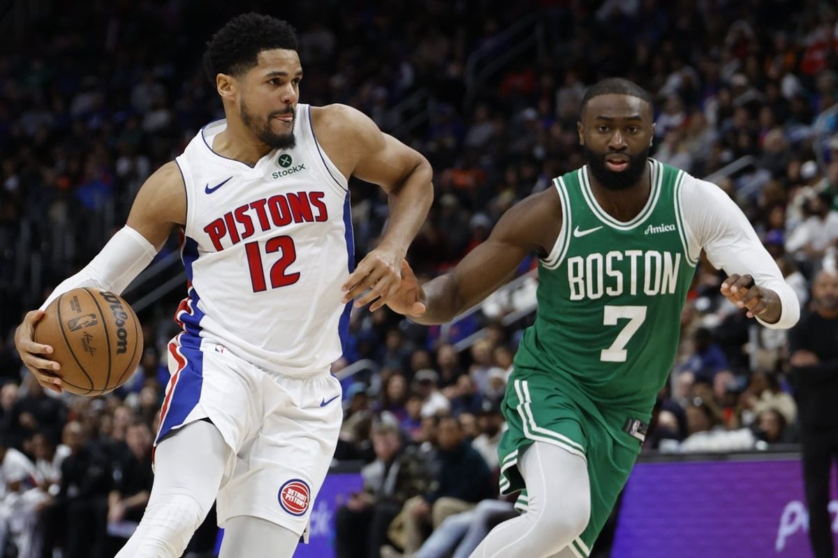 Jan 19, 2026; Detroit, Michigan, USA;  Detroit Pistons forward Tobias Harris (12) drives against Boston Celtics guard Jaylen Brown (7) in the second half at Little Caesars Arena. Mandatory Credit: Rick Osentoski-Imagn Images