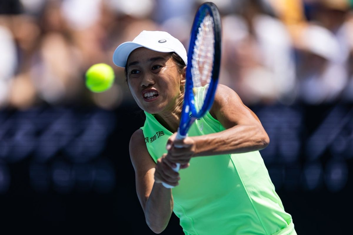 Jan 20, 2026; Melbourne, Victoria, Australia; Shuai Zhang of China in action against Taylah Preston of Australia in the first round of the women’s singles at the Australian Open at Kia Arena in Melbourne Park. Mandatory Credit: Mike Frey-Imagn Images