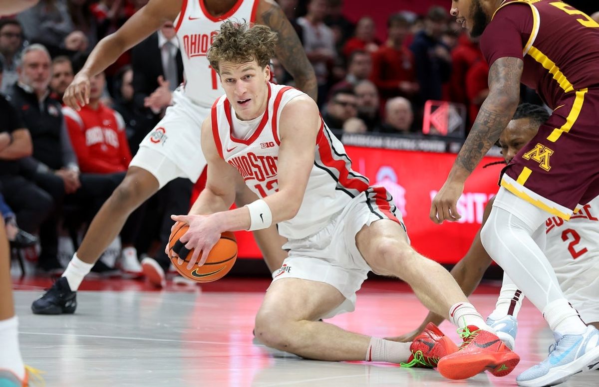 Jan 20, 2026; Columbus, Ohio, USA;  Ohio State Buckeyes center Christoph Tilly (13) grabs a loose ball during the first half against the Minnesota Golden Gophers at Value City Arena. Mandatory Credit: Joseph Maiorana-Imagn Images