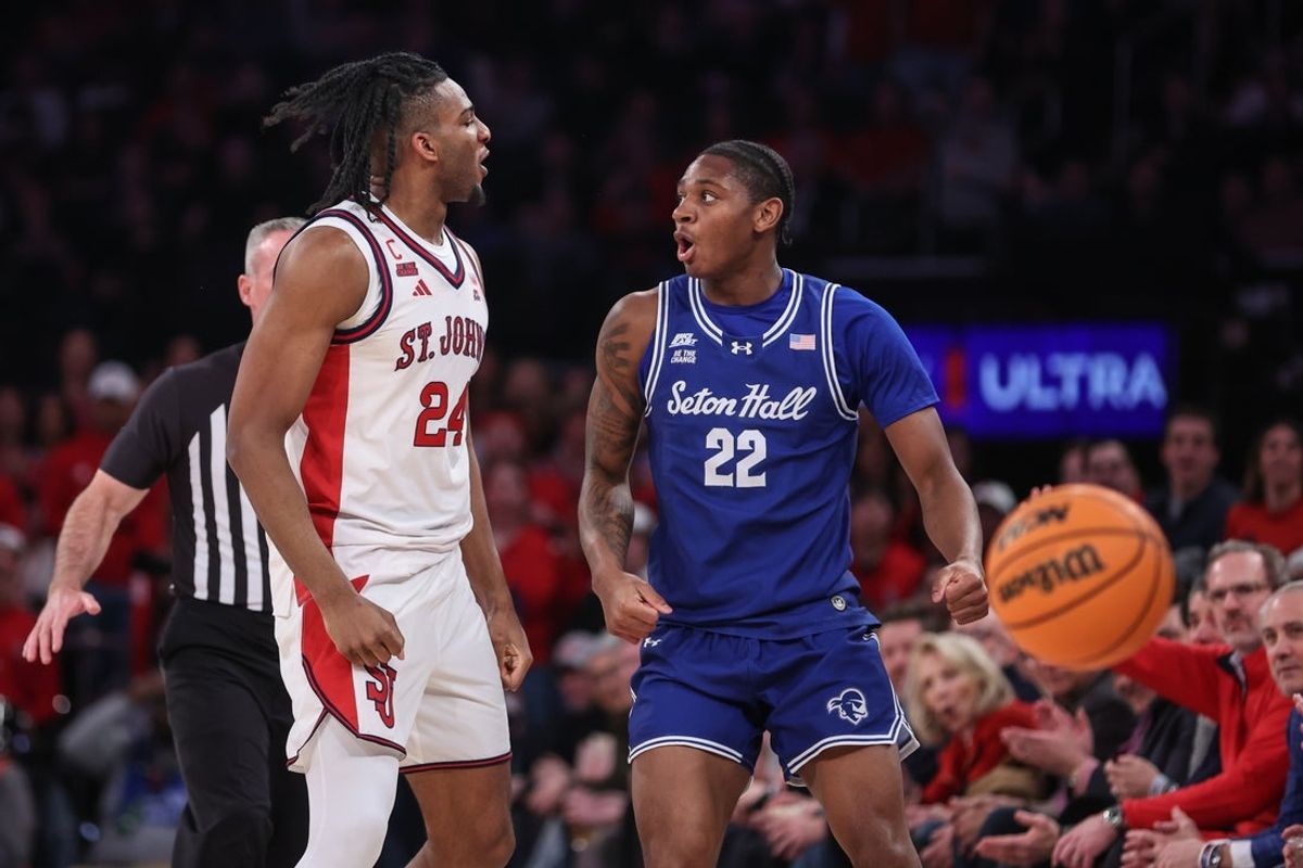 Jan 20, 2026; New York, New York, USA;  St. John's Red Storm forward Zuby Ejiofor (24) and Seton Hall Pirates guard Elijah Fisher (22) exchange words after a jump ball tie up in the first half at Madison Square Garden. Mandatory Credit: Wendell Cruz-Imagn Images