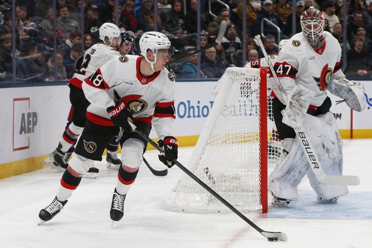 Jan 20, 2026; Columbus, Ohio, USA; Ottawa Senators left wing Tim Stutzle (18) picks up a loose puck against the Columbus Blue Jackets during the second period at Nationwide Arena. Mandatory Credit: Russell LaBounty-Imagn Images