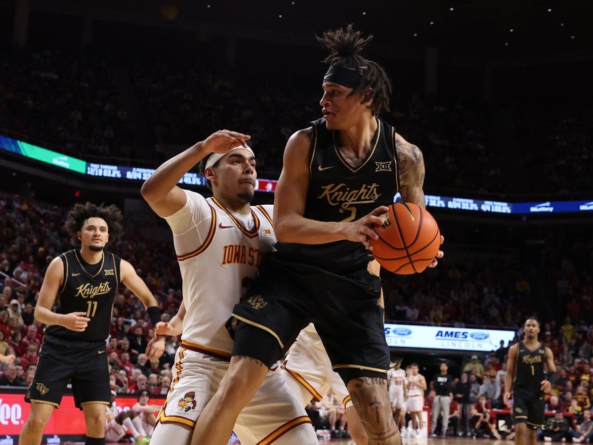 Jan 20, 2026; Ames, Iowa, USA; UCF Knights guard Riley Kugel (2) is defended by Iowa State Cyclones guard Tamin Lipsey (3) during the second half at James H. Hilton Coliseum. Mandatory Credit: Reese Strickland-Imagn Images