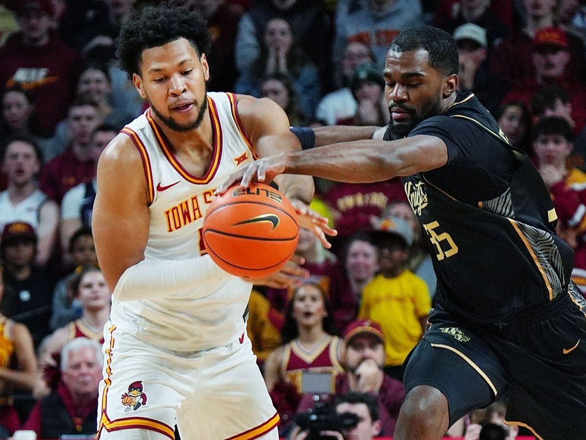 Iowa State Cyclones forward Joshua Jefferson (5) steals the ball from UCF Knights forward Devan Cambridge (35) during the first half in the Big-12 conference men’s basketball on Jan. 20, 2026, at Hilton Coliseum in Ames, Iowa.