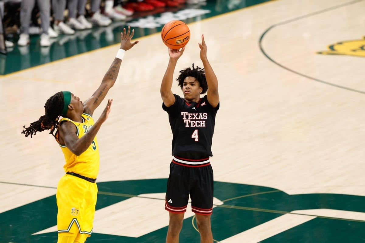 Jan 20, 2026; Waco, Texas, USA;  Texas Tech Red Raiders guard Christian Anderson (4) scores a three-point basket against Baylor Bears guard Obi Agbim (5) during the first half at Paul and Alejandra Foster Pavilion. Mandatory Credit: Chris Jones-Imagn Images