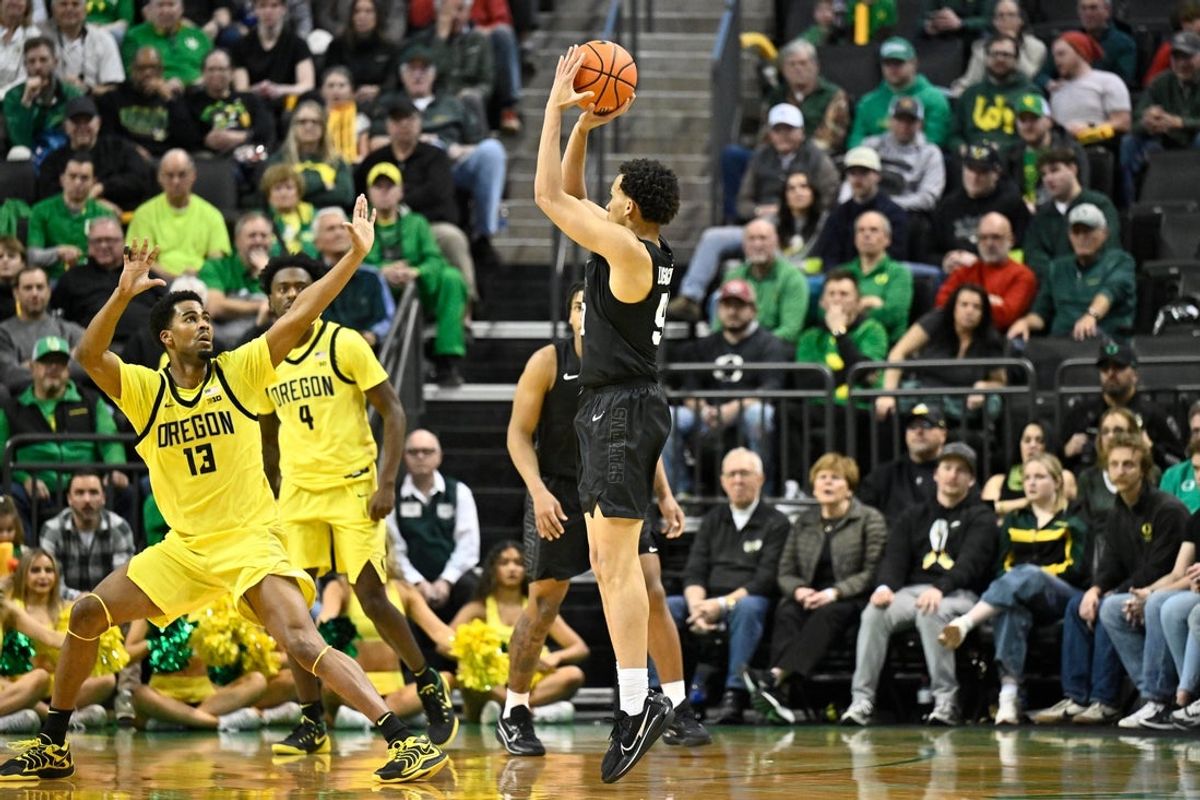 Jan 20, 2026; Eugene, Oregon, USA; Michigan State Spartans guard Divine Ugochukwu (99) shoots the ball during the first half against the Oregon Ducks at Matthew Knight Arena. Mandatory Credit: Craig Strobeck-Imagn Images