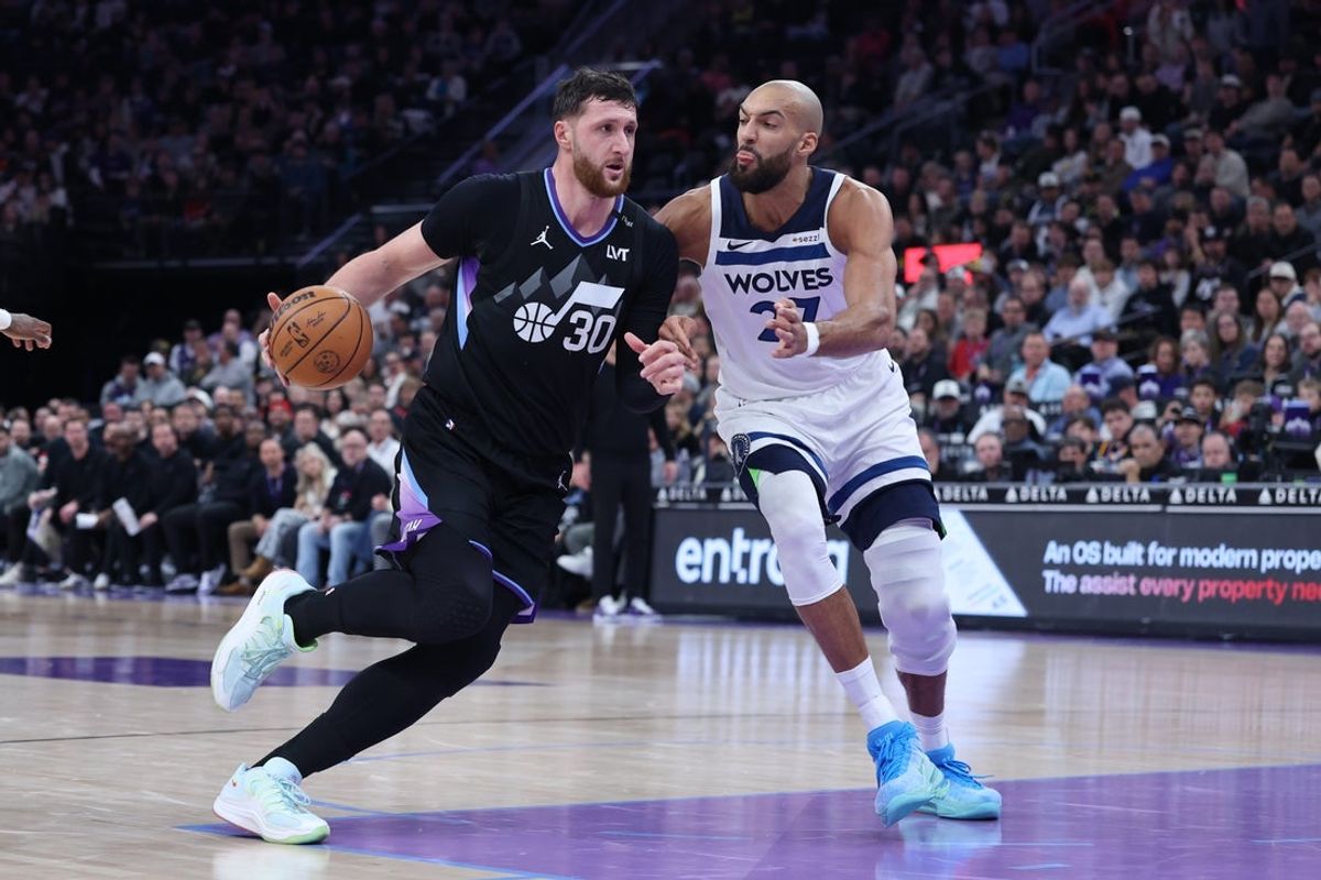 Jan 20, 2026; Salt Lake City, Utah, USA; Utah Jazz center Jusuf Nurkic (30) goes to the basket against Minnesota Timberwolves center Rudy Gobert (27) during the first half at Delta Center. Mandatory Credit: Rob Gray-Imagn Images