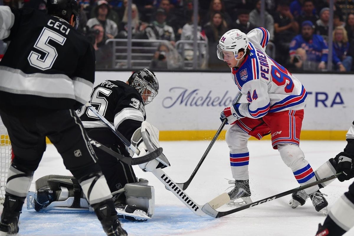 Jan 20, 2026; Los Angeles, California, USA; New York Rangers right wing Gabe Perreault (94) moves in for a shot against Los Angeles Kings goaltender Darcy Kuemper (35) during the first period at Crypto.com Arena. Mandatory Credit: Gary A. Vasquez-Imagn Images