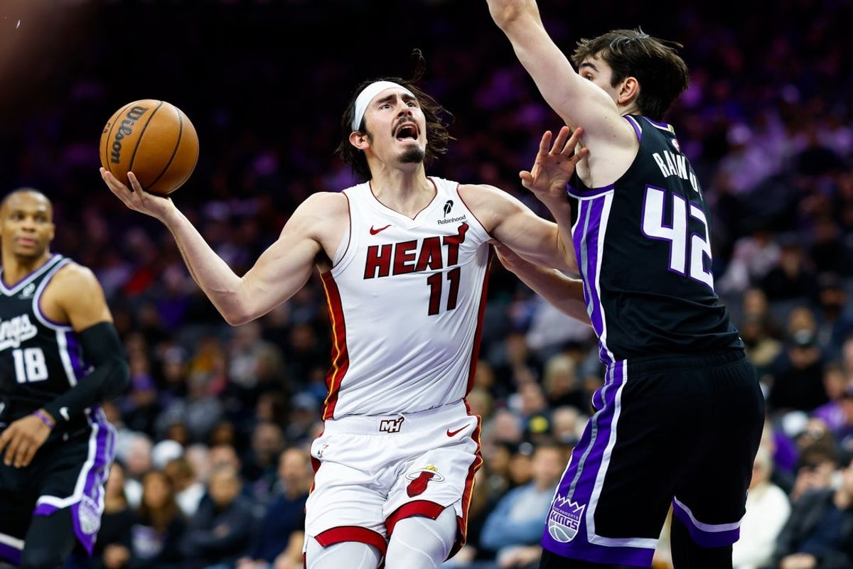 Jan 20, 2026; Sacramento, California, USA; Miami Heat forward Jaime Jaquez Jr. (11) drives to the basket against Sacramento Kings center Maxime Raynaud (42) during the second quarter at Golden 1 Center. Mandatory Credit: Sergio Estrada-Imagn Images