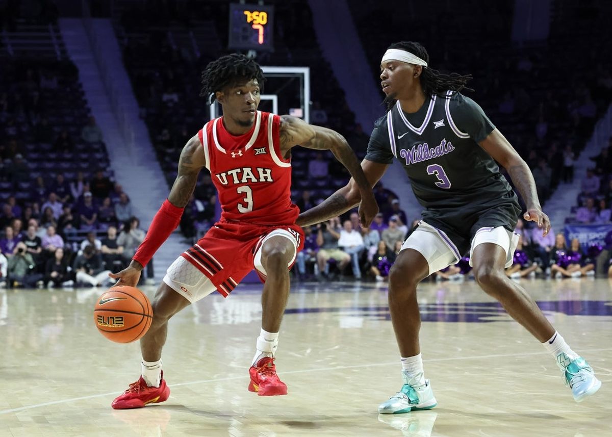 Jan 20, 2026; Manhattan, Kansas, USA; Utah Utes guard Don McHenry (3) dribbles against Kansas State Wildcats guard C.J. Jones (3) during the second half at Bramlage Coliseum. Mandatory Credit: Scott Sewell-Imagn Images