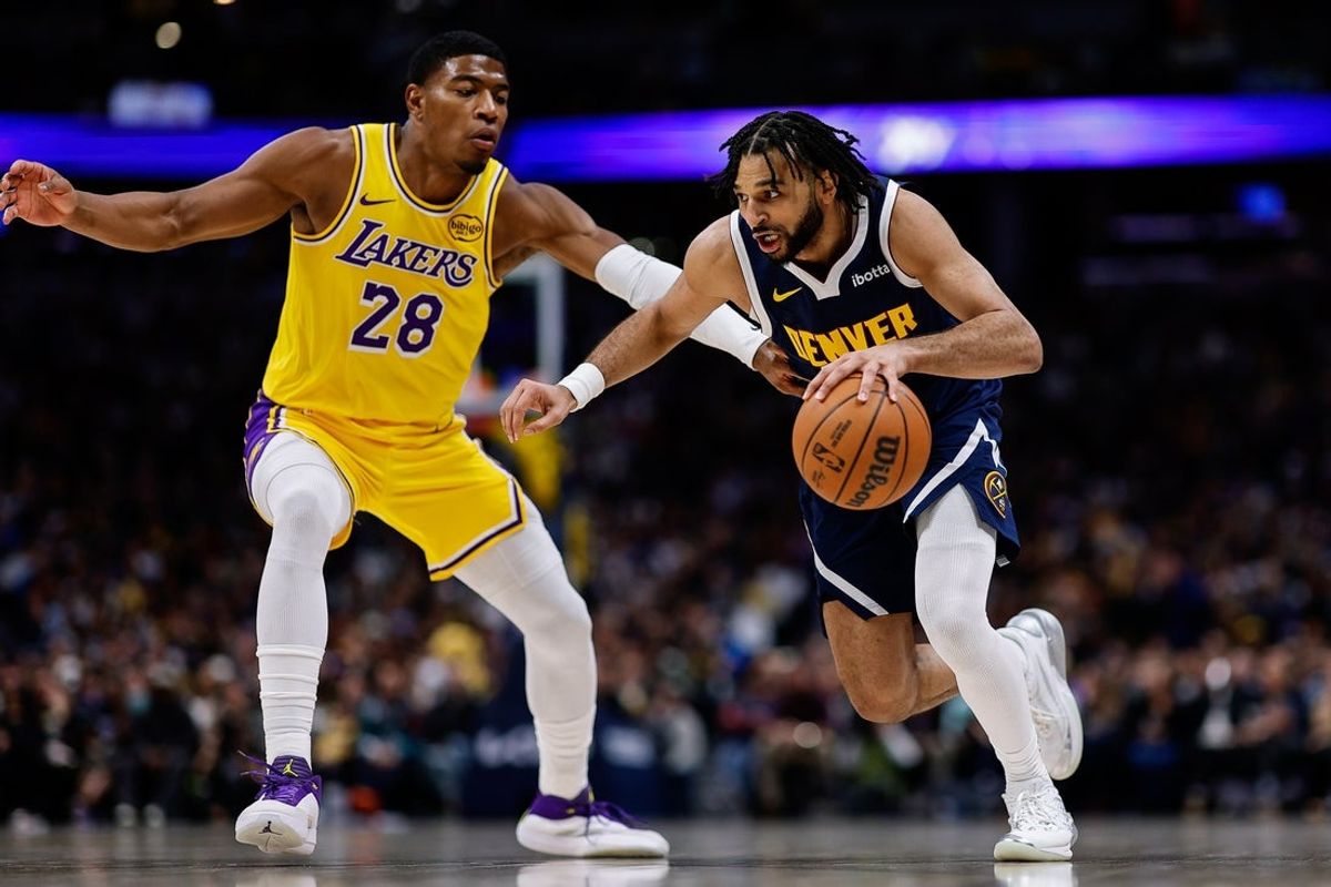 Jan 20, 2026; Denver, Colorado, USA; Denver Nuggets guard Jamal Murray (27) controls the ball as Los Angeles Lakers forward Rui Hachimura (28) guards in the second quarter at Ball Arena. Mandatory Credit: Isaiah J. Downing-Imagn Images