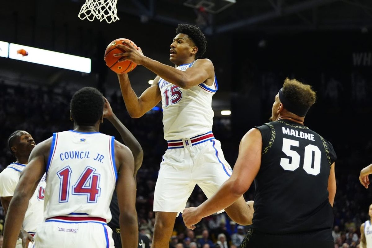 Jan 20, 2026; Boulder, Colorado, USA; Kansas Jayhawks forward Bryson Tiller (15) grabs a rebound in the first half against the Colorado Buffaloes at the CU Events Center. Mandatory Credit: Ron Chenoy-Imagn Images