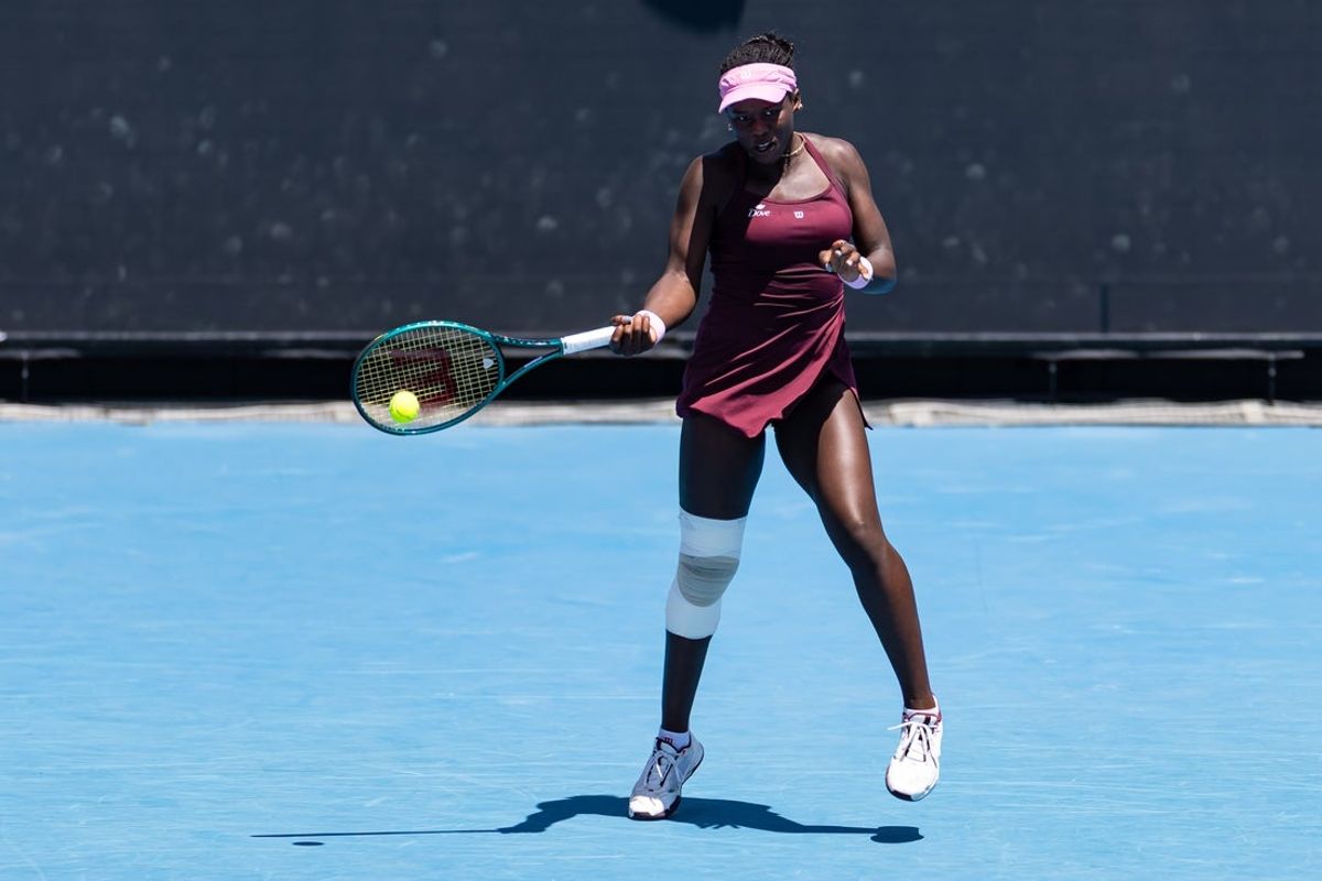 Jan 21, 2026; Melbourne, Victoria, Australia; Victoria Mboko of Canada in action against Caty McNally of United States in the second round of the women’s singles at the Australian Open at 1573 Arena in Melbourne Park. Mandatory Credit: Mike Frey-Imagn Images
