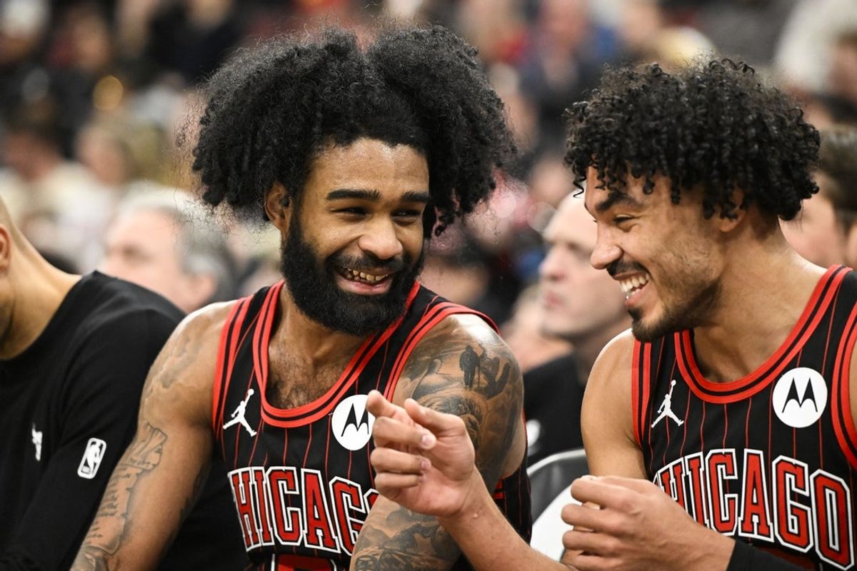 Jan 20, 2026; Chicago, Illinois, USA; Chicago Bulls guard Coby White (0), left, laughs with  guard Tre Jones (30) on the bench during the second half against the LA Clippers at United Center. Mandatory Credit: Matt Marton-Imagn Images