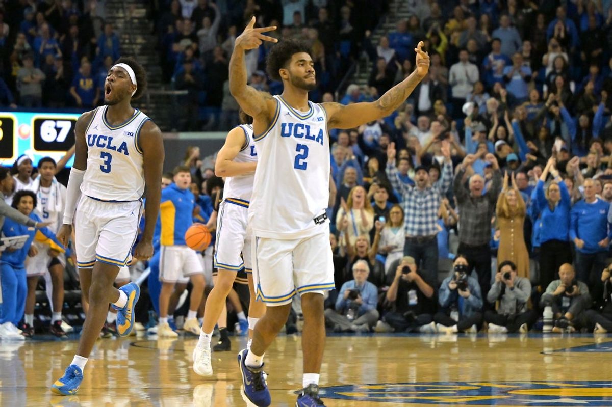 Jan 20, 2026; Los Angeles, California, USA; UCLA Bruins guard Eric Dailey Jr. (3) and and guard Donovan Dent (2) celebrate after defeating the Purdue Boilermakers at Pauley Pavilion presented by Wescom Financial. Mandatory Credit: Jayne Kamin-Oncea-Imagn Images