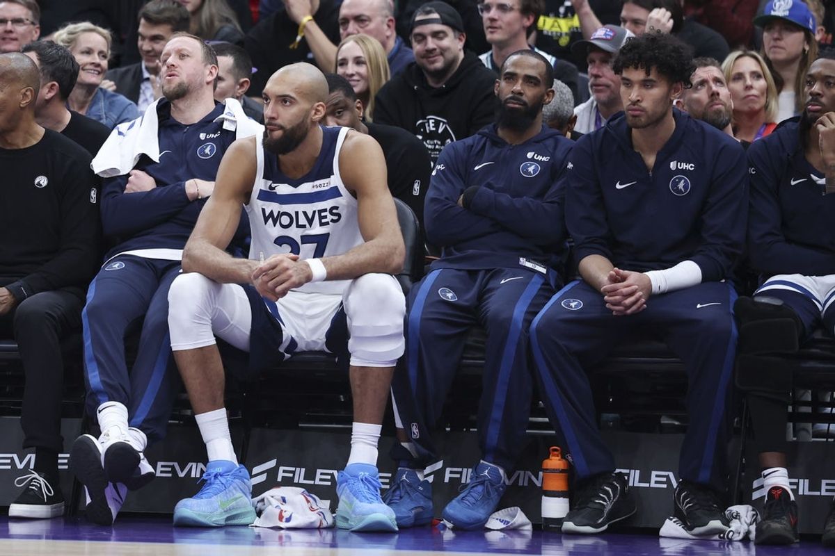 Jan 20, 2026; Salt Lake City, Utah, USA; Former Utah Jazz players from left to right, Minnesota Timberwolves forward Joe Ingles and center Rudy Gobert and guard Mike Conley and guard Johnny Juzang sit on the bench during the second half at Delta Center. Mandatory Credit: Rob Gray-Imagn Images