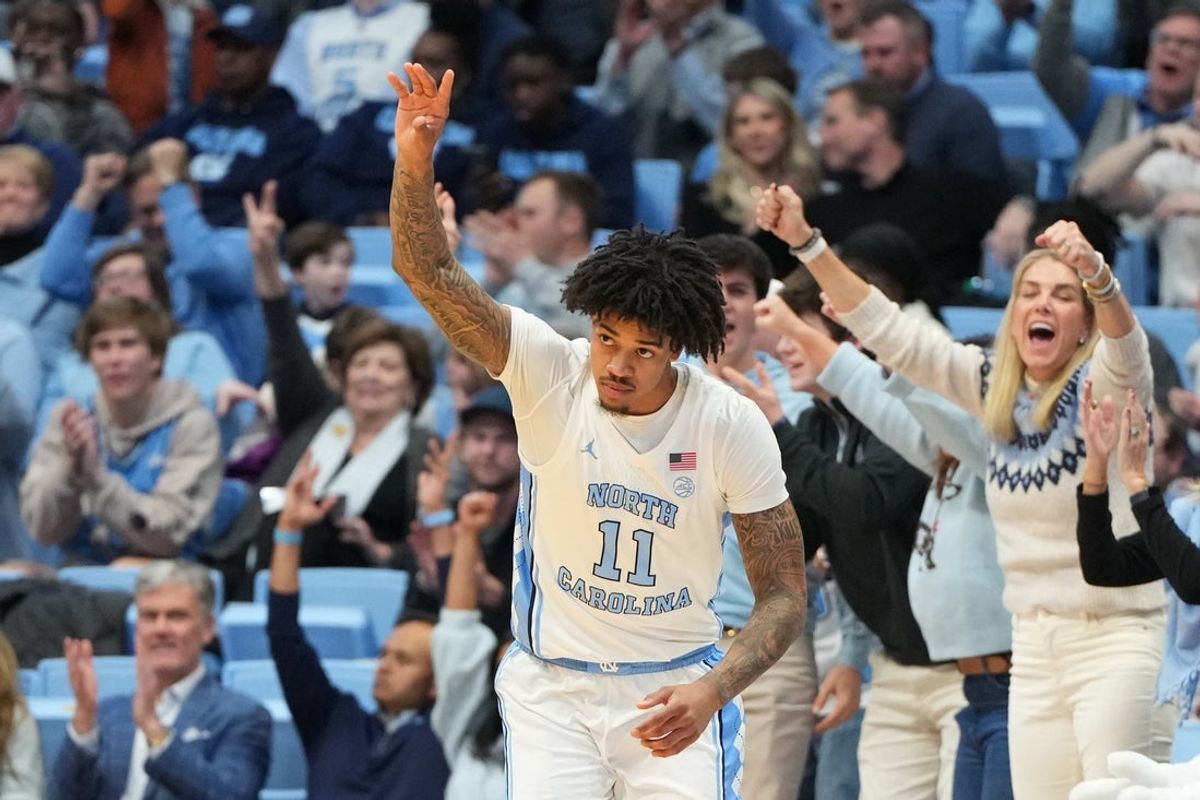 Jan 21, 2026; Chapel Hill, North Carolina, USA; North Carolina Tar Heels forward Jonathan Powell (11) reeacts after making a three point shot in the first half at Dean E. Smith Center. Mandatory Credit: Bob Donnan-Imagn Images