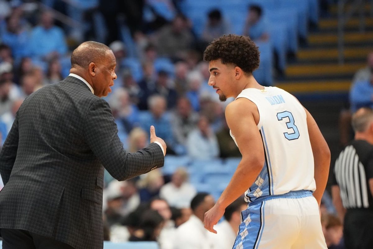 Jan 21, 2026; Chapel Hill, North Carolina, USA; North Carolina Tar Heels head coach Hubert Davis with guard Derek Dixon (3) in the first half at Dean E. Smith Center. Mandatory Credit: Bob Donnan-Imagn Images
