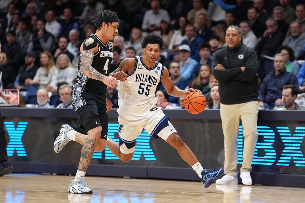 Jan 21, 2026; Villanova, Pennsylvania, USA; Villanova Wildcats guard Devin Askew (5) drives against Georgetown Hoyas forward Caleb Williams (4) in the first half at William B. Finneran Pavilion. Mandatory Credit: Kyle Ross-Imagn Images