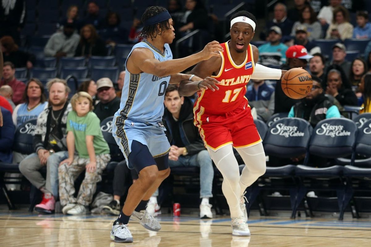 Jan 21, 2026; Memphis, Tennessee, USA; Atlanta Hawks forward Onyeka Okongwu (17) dribbles as Memphis Grizzlies forward Jaylen Wells (0) defends during the first quarter at FedExForum. Mandatory Credit: Petre Thomas-Imagn Images