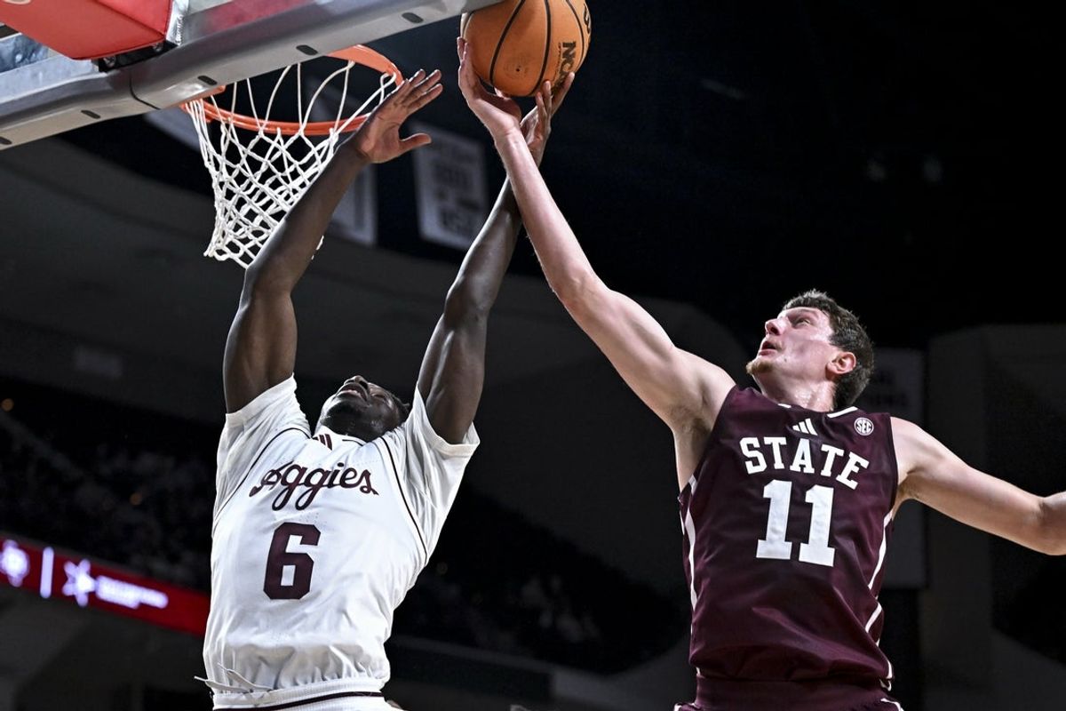 Jan 21, 2026; College Station, Texas, USA; Mississippi State Bulldogs forward Sergej MacUra (11) attempts to block a shot from Texas A&M Aggies guard Ali Dibba (6) during the first half at Reed Arena. Mandatory Credit: Maria Lysaker-Imagn Images