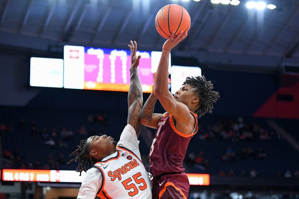Jan 21, 2026; Syracuse, New York, USA; Virginia Tech Hokies guard Ben Hammond (3) shoots against Syracuse Orange guard Bryce Zephir (55) during the first half at the JMA Wireless Dome. Mandatory Credit: Rich Barnes-Imagn Images