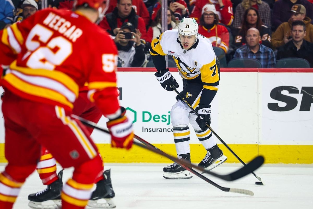 Jan 21, 2026; Calgary, Alberta, CAN; Pittsburgh Penguins center Evgeni Malkin (71) controls the puck against the Calgary Flames during the first period at Scotiabank Saddledome. Mandatory Credit: Sergei Belski-Imagn Images