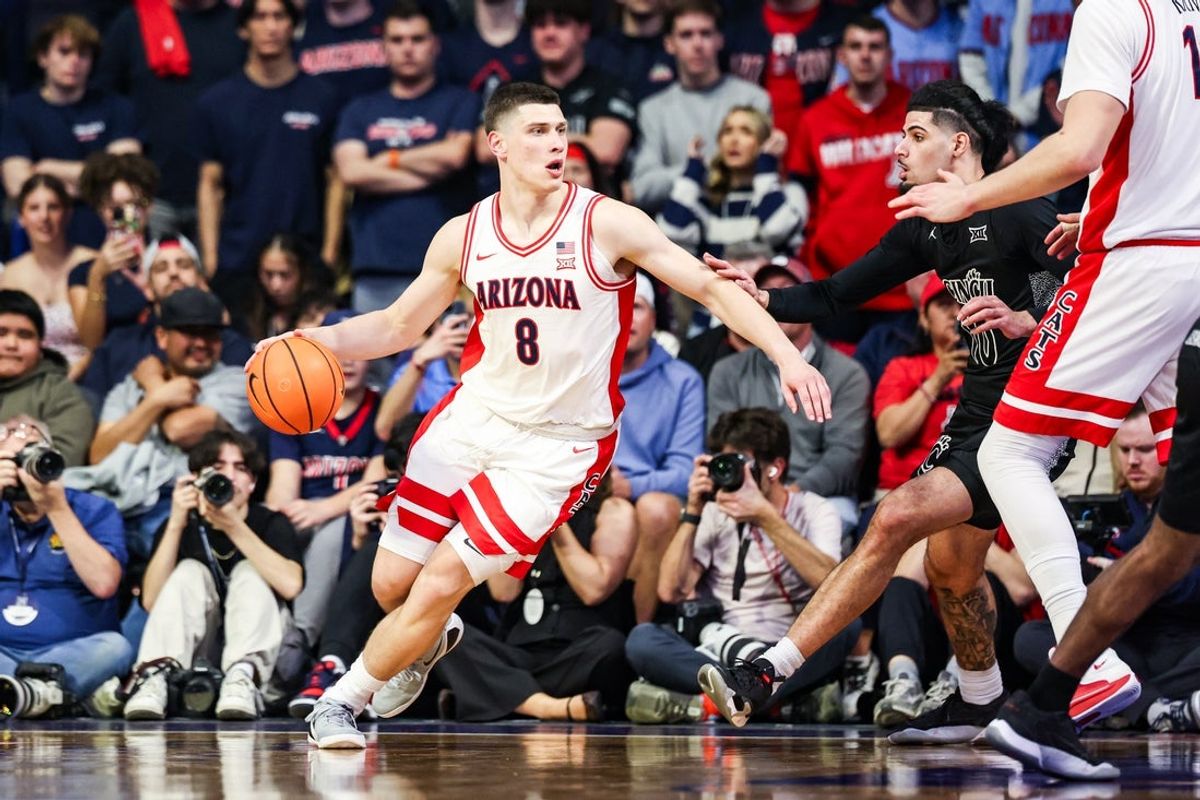 Jan 21, 2026; Tucson, Arizona, USA; Arizona Wildcats forward Ivan Kharchenkov (8) dribbles the ball during the first half of the game at McKale Memorial Center. Mandatory Credit: Aryanna Frank-Imagn Images