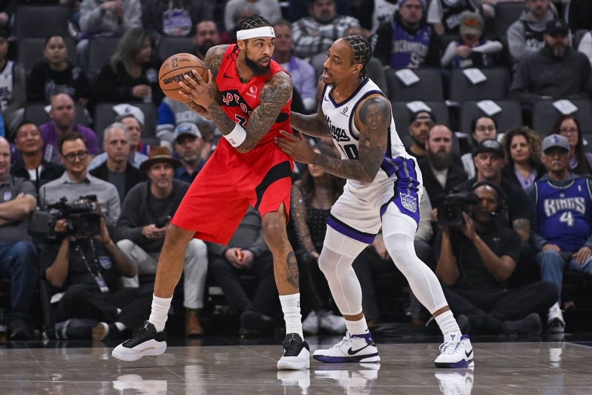 Jan 21, 2026; Sacramento, California, USA; Toronto Raptors forward Brandon Ingram (3) controls the ball against Sacramento Kings guard/forward DeMar DeRozan (10) during the first quarter at Golden 1 Center. Mandatory Credit: Ed Szczepanski-Imagn Images