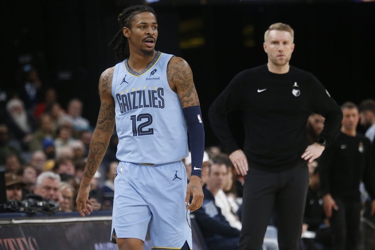 Jan 21, 2026; Memphis, Tennessee, USA; Memphis Grizzlies guard Ja Morant (12) and head coach Tuomas Iisalo looks on during the third quarter against the Atlanta Hawks at FedExForum. Mandatory Credit: Petre Thomas-Imagn Images