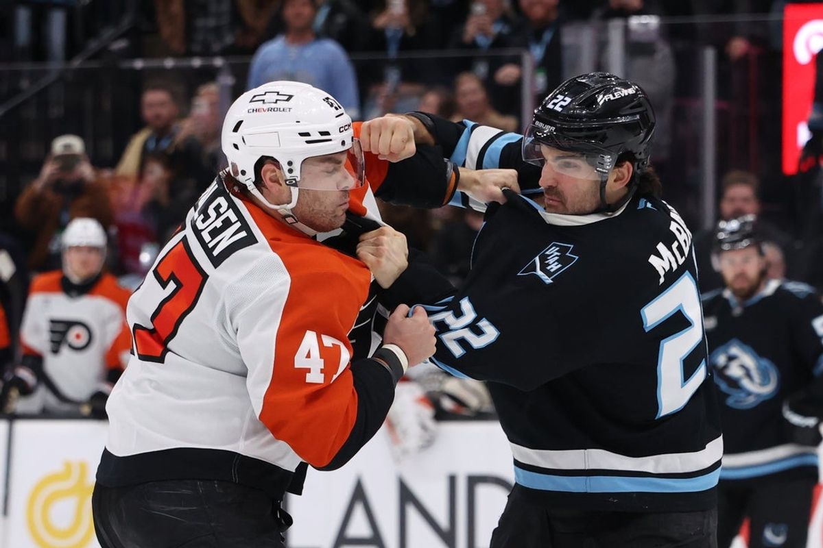 Jan 21, 2026; Salt Lake City, Utah, USA; Philadelphia Flyers defenseman Noah Juulsen (47) and Utah Mammoth center Jack McBain (22) fight during the third period at Delta Center. Mandatory Credit: Rob Gray-Imagn Images