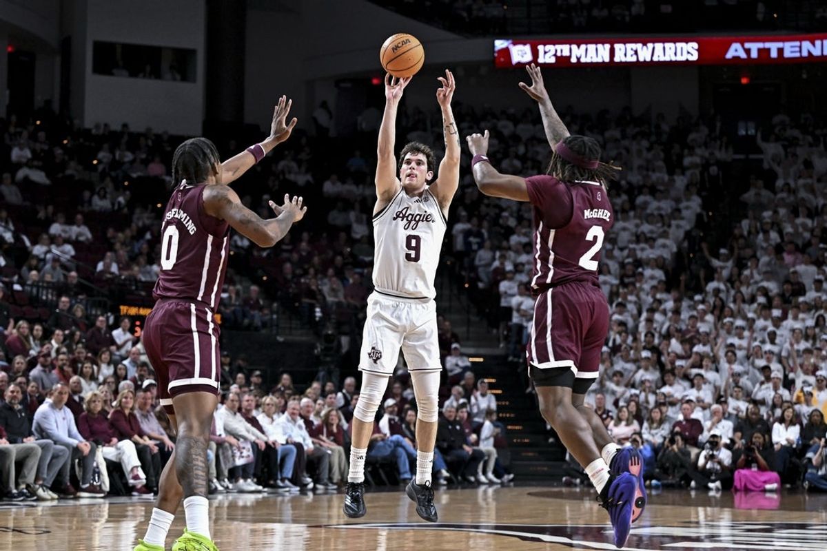 Jan 21, 2026; College Station, Texas, USA; Texas A&M Aggies guard Ruben Dominguez (9) shoots a three point basket during the first half against the Mississippi State Bulldogs at Reed Arena. Mandatory Credit: Maria Lysaker-Imagn Images