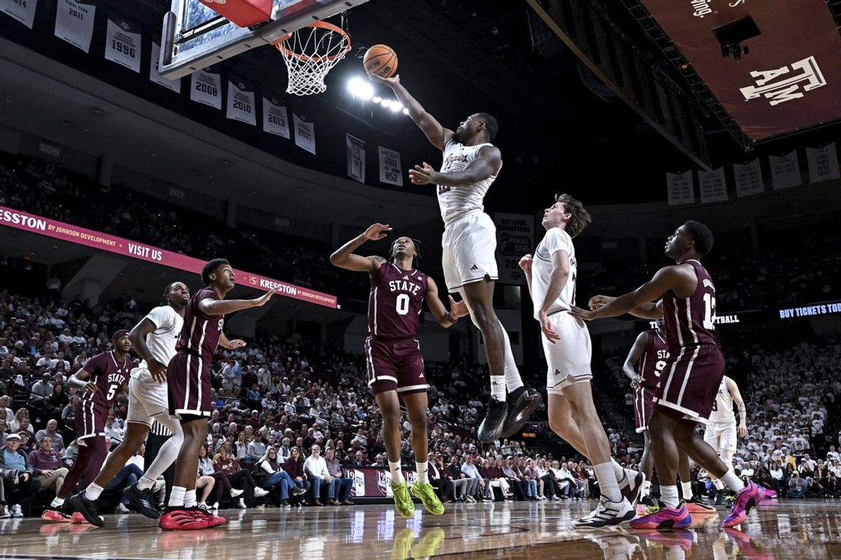 Jan 21, 2026; College Station, Texas, USA; Texas A&M Aggies forward Rashaun Agee (12) lays up the ball during the first half against the Mississippi State Bulldogs at Reed Arena. Mandatory Credit: Maria Lysaker-Imagn Images
