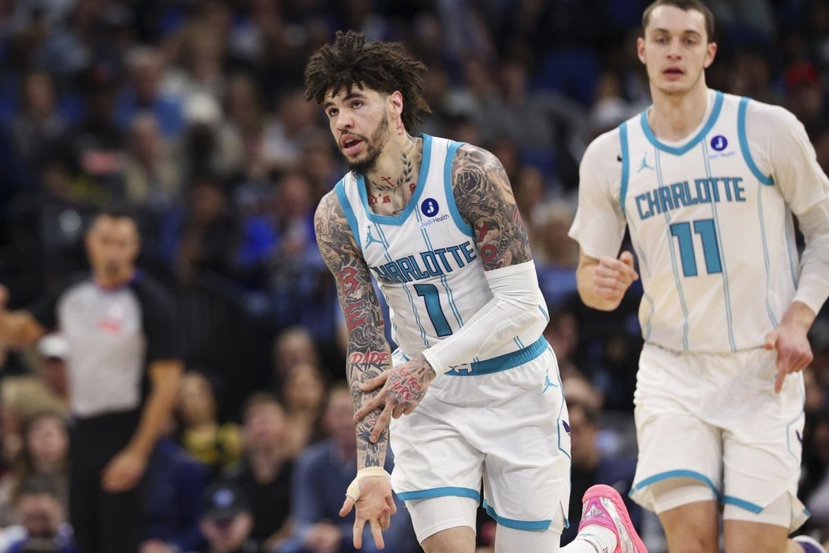 Jan 22, 2026; Orlando, Florida, USA; Charlotte Hornets guard LaMelo Ball (1) reacts after making a basket against the Orlando Magic in the second quarter at Kia Center. Mandatory Credit: Nathan Ray Seebeck-Imagn Images