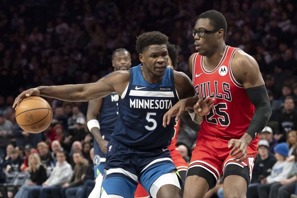 Jan 22, 2026; Minneapolis, Minnesota, USA; Minnesota Timberwolves guard Anthony Edwards (5) dribbles the ball past Chicago Bulls forward Jalen Smith (25) in the first half at Target Center. Mandatory Credit: Jesse Johnson-Imagn Images