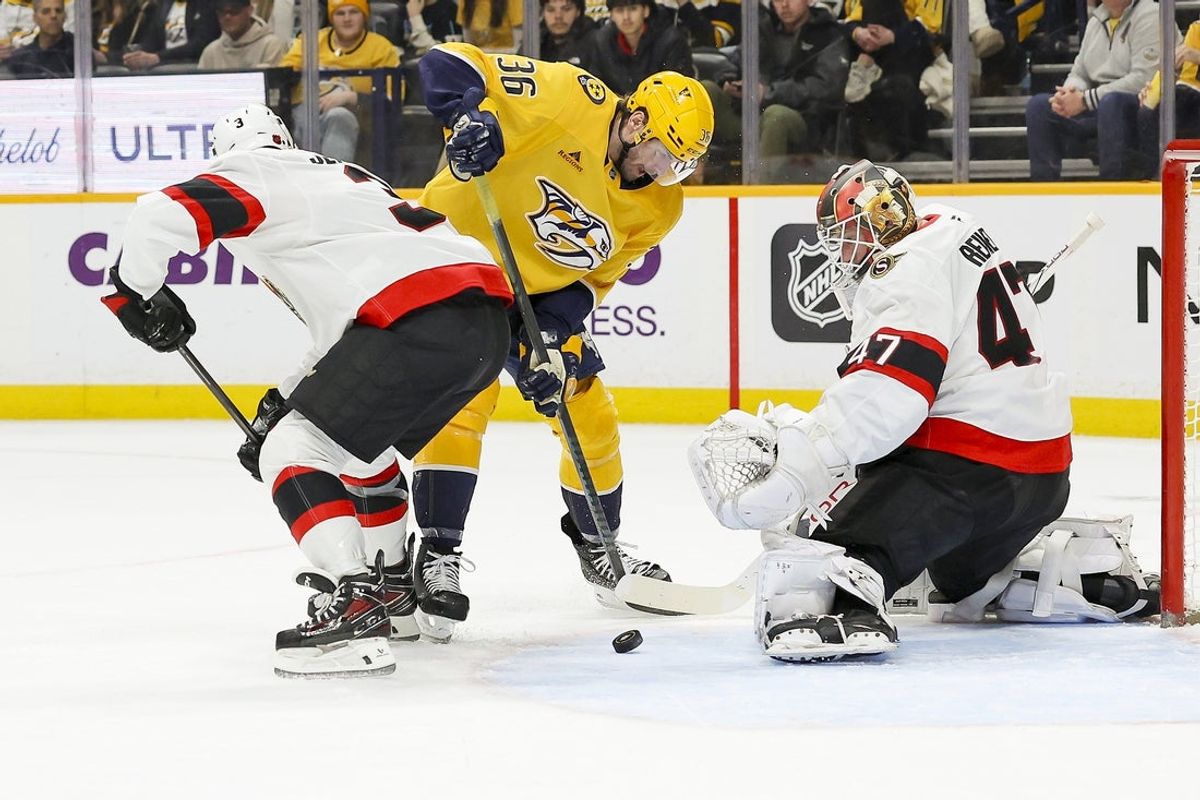 Jan 22, 2026; Nashville, Tennessee, USA; Ottawa Senators goaltender James Reimer (47) blocks the shot of Nashville Predators left wing Cole Smith (36) during the first period at Bridgestone Arena. Mandatory Credit: Steve Roberts-Imagn Images