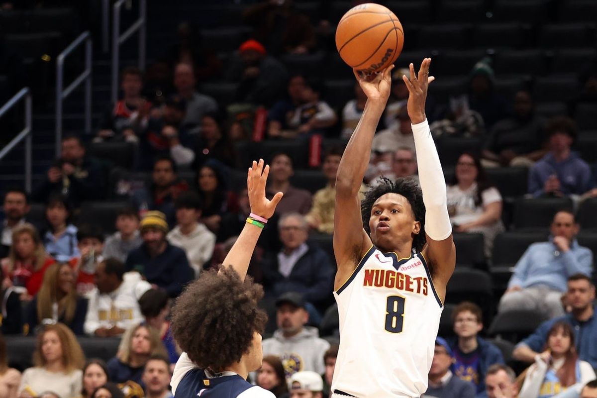Jan 22, 2026; Washington, District of Columbia, USA; Denver Nuggets guard Peyton Watson (8) shoots over Washington Wizards forward Kyshawn George (18) during the second half at Capital One Arena. Mandatory Credit: Daniel Kucin Jr.-Imagn Images