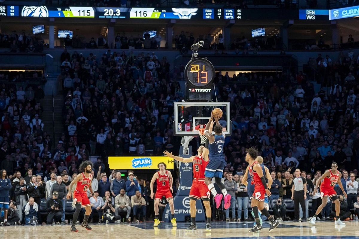 Jan 22, 2026; Minneapolis, Minnesota, USA; Minnesota Timberwolves guard Anthony Edwards (5) attempts a shot over Chicago Bulls center Nikola Vucevic (9) in the fourth quarter at Target Center. Mandatory Credit: Jesse Johnson-Imagn Images