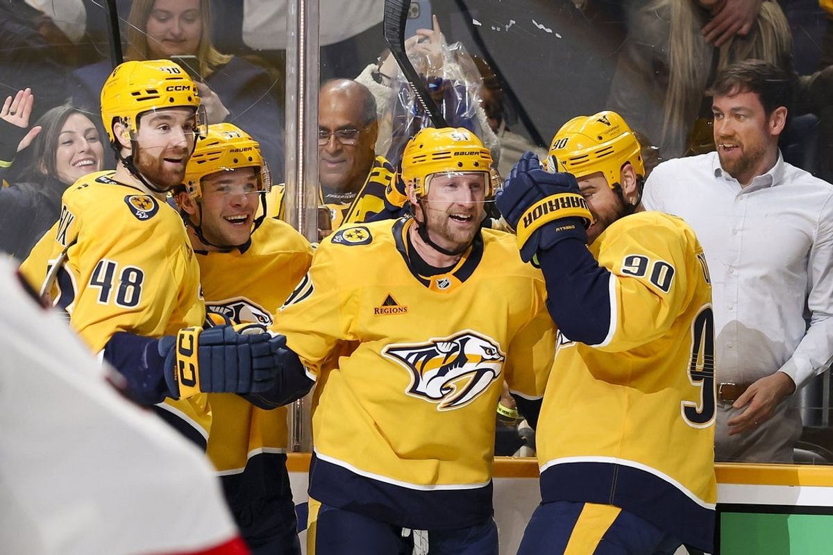 Jan 22, 2026; Nashville, Tennessee, USA;  Nashville Predators center Steven Stamkos (91) celebrates with teammates after scoring a goal and a hat trick against the Ottawa Senators during the third period at Bridgestone Arena. Mandatory Credit: Steve Roberts-Imagn Images