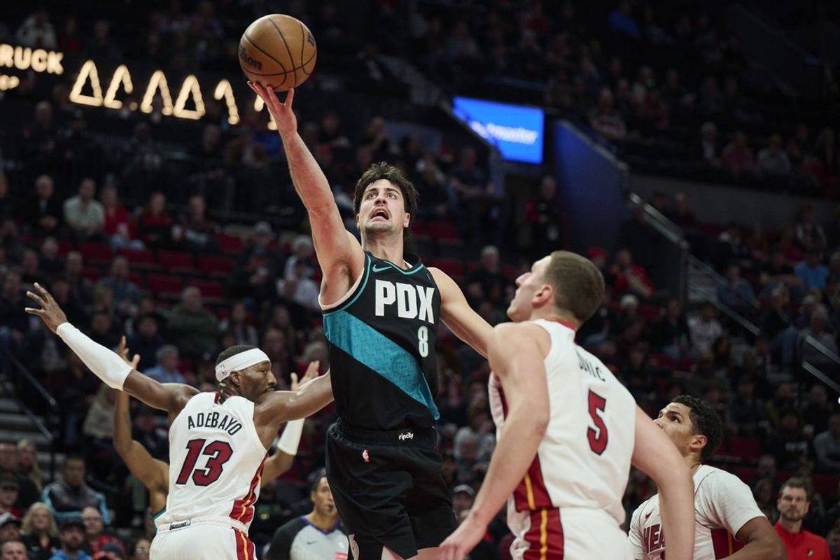 Jan 22, 2026; Portland, Oregon, USA; Portland Trail Blazers forward Deni Avdija (8) scores a basket during the first half against Miami Heat forward Nikola Jovic (5) at Moda Center. Mandatory Credit: Troy Wayrynen-Imagn Images
