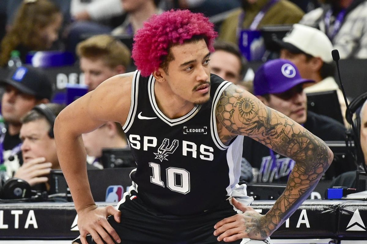 Jan 22, 2026; Salt Lake City, Utah, USA; San Antonio Spurs forward Jeremy Sochan (10) stretches before substituting in during the second half against the Utah Jazz at Delta Center. Mandatory Credit: Peter Creveling-Imagn Images