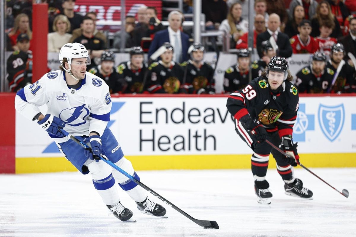 Jan 23, 2026; Chicago, Illinois, USA; Tampa Bay Lightning defenseman Charle-Edouard D'Astous (51) looks to pass the puck against the Chicago Blackhawks during the first period at United Center. Mandatory Credit: Kamil Krzaczynski-Imagn Images