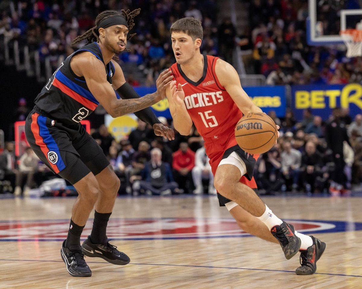 Jan 23, 2026; Detroit, Michigan, USA; Detroit Pistons guard Daniss Jenkins (24) defends against Houston Rockets guard Reed Sheppard (15) during the first half at Little Caesars Arena. Mandatory Credit: David Reginek-Imagn Images