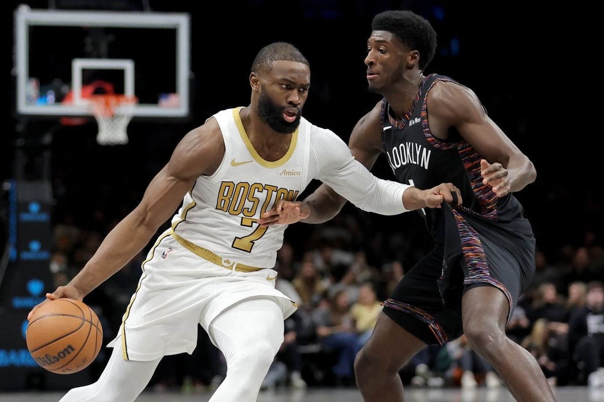 Jan 23, 2026; Brooklyn, New York, USA; Boston Celtics guard Jaylen Brown (7) drives to the basket against Brooklyn Nets guard Drake Powell (4) during the second quarter at Barclays Center. Mandatory Credit: Brad Penner-Imagn Images