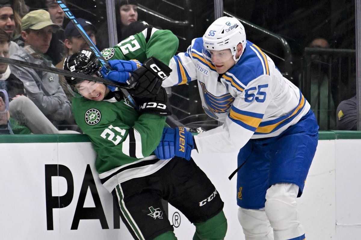 Jan 23, 2026; Dallas, Texas, USA; St. Louis Blues defenseman Colton Parayko (55) checks Dallas Stars left wing Jason Robertson (21) during the first period at the American Airlines Center. Mandatory Credit: Jerome Miron-Imagn Images