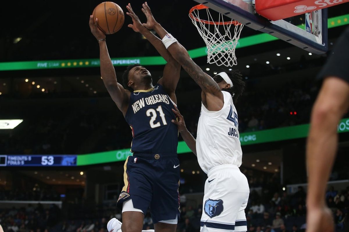 Jan 23, 2026; Memphis, Tennessee, USA; New Orleans Pelicans center Yves Missi (21) drives to the basket as Memphis Grizzlies forward GG Jackson II (45) defends during the second quarter at FedExForum. Mandatory Credit: Petre Thomas-Imagn Images